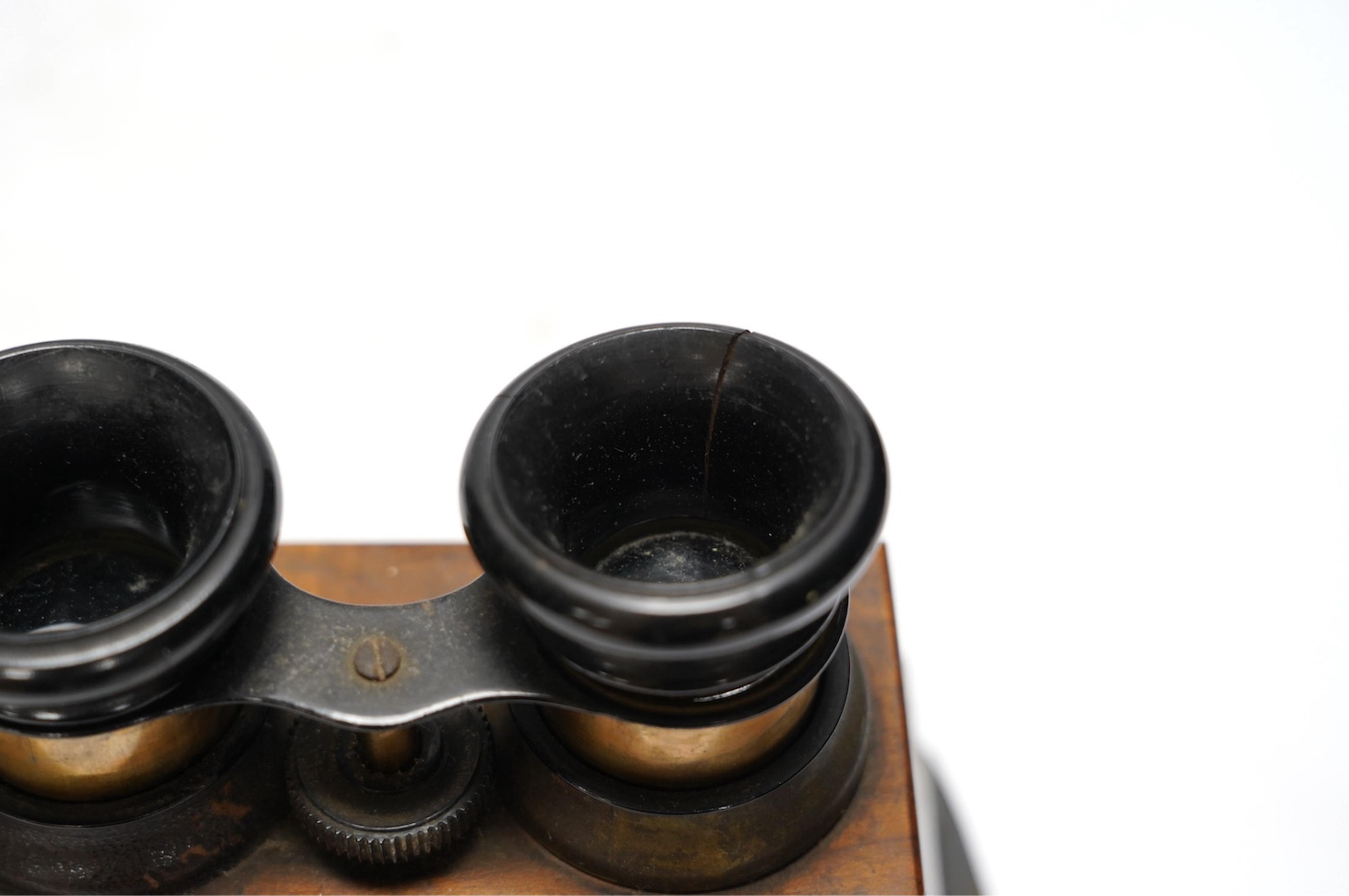 A late 19th century cased stereoscopic viewer together with topographical and other cards. Condition - fair